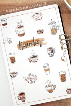 an open notebook with coffee related items on it and the words november written in cursive writing