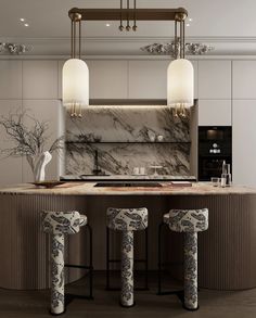 a kitchen with marble counter tops and stools in front of an island that has three lights hanging from it