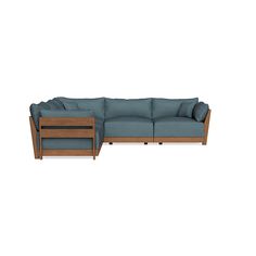 the sectional sofa is made from wood and has blue fabric on it's back