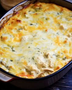 a casserole dish with chicken, cheese and broccoli