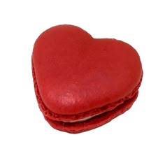 two red heart shaped cookies sitting on top of each other