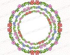 a circular frame with flowers and leaves