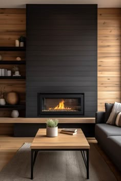 a living room with a couch, coffee table and fire place in the fireplace area