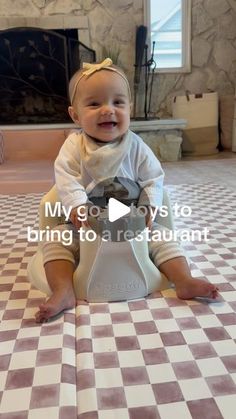 a baby sitting on the floor in front of a fireplace smiling at the camera with text overlay that reads, my go - to ways to bring to a restaurant