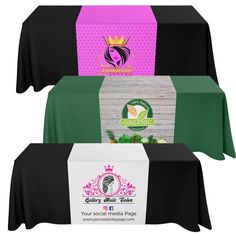 three tables with black and white tablecloths on them, one has a pink box