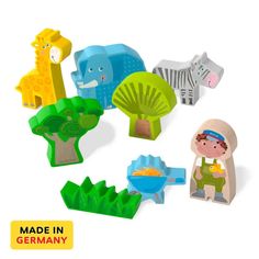 various wooden toys including giraffes, zebras and other animal shapes on a white background