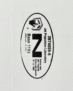 a white and black sticker with the letter z on it