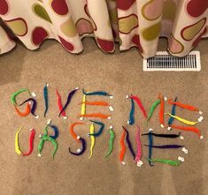 the word give me sunshine spelled out on the floor with crayons in front of it