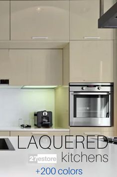 an image of a kitchen setting with white cabinets and black appliances on the counter top