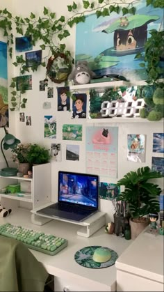 a laptop computer sitting on top of a white desk