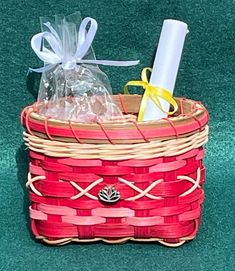 a red basket with some items in it