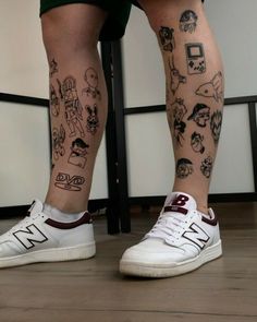 the legs and ankles of a person with tattoos on them