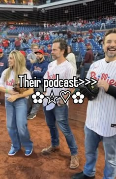 some people are standing in the dirt at a baseball game and one is holding a bat