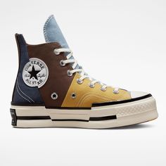 Style No. A02871C Color: Earthy Brown/Navy High-top sneaker with material split upper made from canvas, twill, and poly-cotton denim. OrthoLite cushioning for all-day comfort. An asymmetrical, fused design and elongated tongue for standout style. A split rubber outsole distorts heritage Chuck Taylor design elements. A spliced Chuck Taylor ankle patch. Chuck 70 Plus Material Mashup Unisex High Top Shoes. Womens Converse Lugged, Cheap High-top Canvas Shoes, Brown High-top Sneakers, Custom Jordans Cordaroy, Converse Earthy Tone Platform, Cheap Converse High-top Sneakers With Round Toe, High Converse Boot, Converse High Top Women, Green High-top Affordable Sneakers