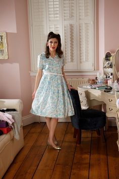 Adorable pastels and timeless vintage style make this sweet little cotton shirtwaister by Lynda Lou a dream to wear. It has a busy floral print in cornflower blue, mint green and pale pink against a white background. Button through front to waist and short sleeves. Peter Pan Collar with piped trim. The cotton is super soft and delicate and semi-sheer. A perfect picnic dress, or even an adorable bridal shower, wedding or elopment dress for a bride who likes to do things a little differently. This Vintage Light Blue Dress For Daywear, Light Blue Vintage Daywear Dress, Vintage Light Blue Daywear Dress, Vintage Light Blue Dress For Garden Party, Pastel Fitted Dress For Daywear, Fitted Pastel Dress For Daywear, Vintage Fitted Pastel Dresses, Fitted Vintage Dress In Pastel, Fitted Vintage Dresses In Pastel Colors