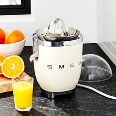 Smeg Pink Citrus Juicer + Reviews | Crate and Barrel Smeg Cream, Retro Refrigerator, Kitchen Tech, Juice Extractor, Electric Juicer, Citrus Juicer, Crate Barrel, Eating Raw, House Decoration