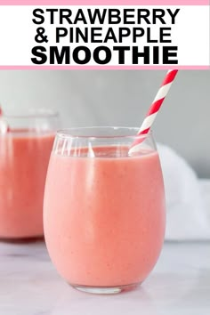 two glasses filled with strawberry and pineapple smoothie on top of a white counter