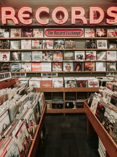 record store with records on shelves and neon sign