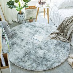 a round rug on the floor in a bedroom