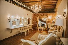 a living room filled with furniture and a chandelier