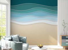 a living room scene with focus on the couch and wall paper that looks like waves