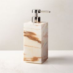 Rectangular soap pump is crafted of Calacatta gold marble with rich natural veining and a smooth finish. Pair with the full Ramsey Calacatta gold marble bath collection for a coordinated look. CB2 exclusive.     Solid Calacatta gold marble  Stainless steel pump  Variation in veining and activity of marble is to be expected; each will be unique  Wipe with a soft cloth  Imported Ramsey Calacatta Gold Marble Soap Pump White Bathroom Storage, Marble Soap, White Bath Mat, Calacatta Gold Marble, Apartment Stuff, Marble Bath, Bath Collection, Calacatta Gold, Large Candle Holders