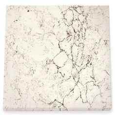 a white marble tile with cracks in it