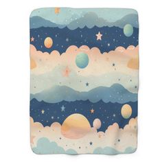 a blanket with planets and stars in the sky on top of blue clouds, against a white background