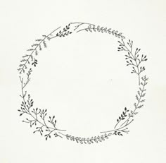 a black and white drawing of a circular frame with leaves on the inside, drawn by hand