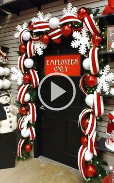 an employee only sign is displayed in front of a door decorated with christmas decorations and snowflakes