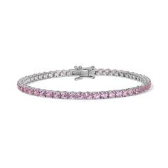 Enhance your jewelry collection with the captivating beauty of our Pink Sapphire Tennis Bracelet. Adorned with vivid pink gemstones, this exquisite piece radiates elegance and charm. Available in 14K Yellow Gold and White Gold Carat weights are reflective of a 7in bracelet. Shorter lengths will have lower carat weights that those listed. Gemstones are natural, therefore colors may vary Sapphire Tennis Bracelet, Diamond Cocktail Rings, Tennis Necklace, Band Bracelet, Pink Gemstones, Diamond Shop, Bracelet Collection, Earrings Collection, Ring Collections