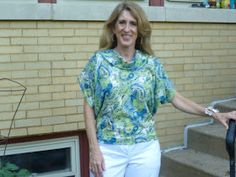 a woman standing next to a stair case