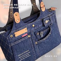 a purse made out of jeans with leather handles