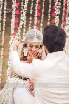 the bride and groom are getting ready for their hindu wedding ceremony in an outdoor setting