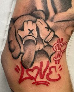 a tattoo on the leg of a man with an elephant and dollar sign painted on it