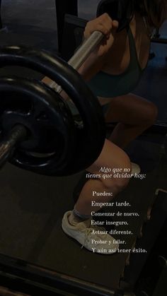 a woman is squatting down with a barbell in her hand and the words above her