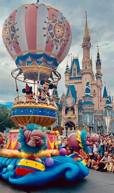 an elaborate float in front of a castle