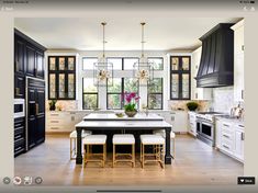 a kitchen with black cabinets and white counter tops