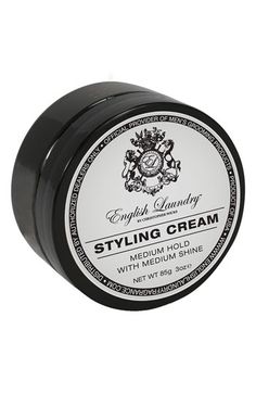 an image of styling cream in black tin on white background with clipping for text