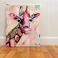 a painting of a giraffe on a wood floor in front of a white wall