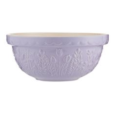 a purple bowl sitting on top of a white table