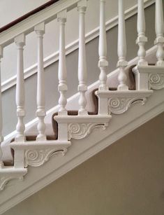 an image of a staircase with white railings