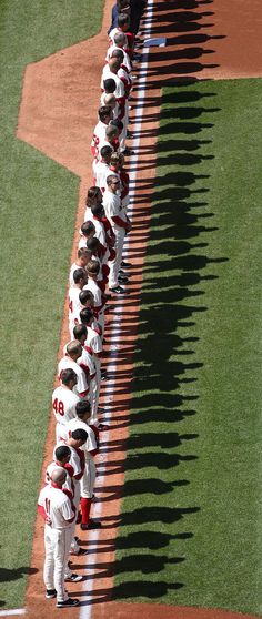 the baseball team is lined up on the field to take their place in the line