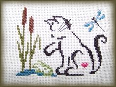 a cross stitch picture of a horse and flowers