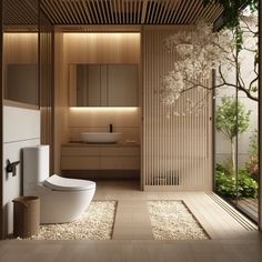 a bathroom with a toilet, sink and shower in the middle of wood paneled walls