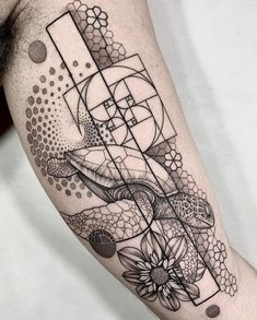 a man's arm with an abstract tattoo design on the left side of his body