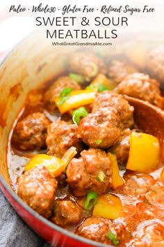 meatballs and vegetables are in a red bowl