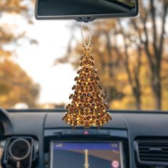 a christmas tree hanging from the dashboard of a car