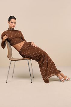 Make an entrance that will instantly dazzle everyone in the Lulus Incomparable Shine Brown Mesh Rhinestone Two-Piece Maxi Dress! Sparkling square-cut rhinestones adorn stretchy mesh knit as it shapes this modern two-piece dress that starts with a mock neck crop top with a fitted bodice and long sheer sleeves. The matching skirt features an elasticized, high waist that tops a figure-skimming column skirt with a maxi hem and a flirty kick pleat at the back. Top has an exposed silver zipper/hidden Spring Sheer Brown Dress, Mesh Rhinestone Dress, Fitted Sheer Brown Dresses, Brown Sequin Midi Dress, Brown Printed Long Sleeve Maxi Dress, Mock Neck Maxi Dress, Brown Embellished Mesh Dress, Mock Neck Crop Top, Black Tie Wedding Guests