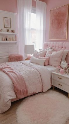 a bedroom decorated in pink and white with fur rugs on the floor next to bed